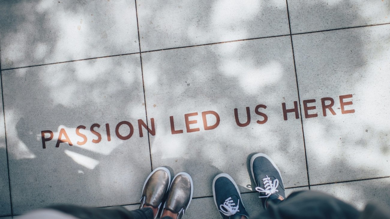 two person standing on gray tile paving